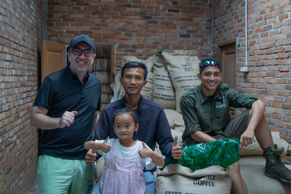 Green coffee beans sourcing team at origin with greenbean coffee sacks team The Jungle Coffee